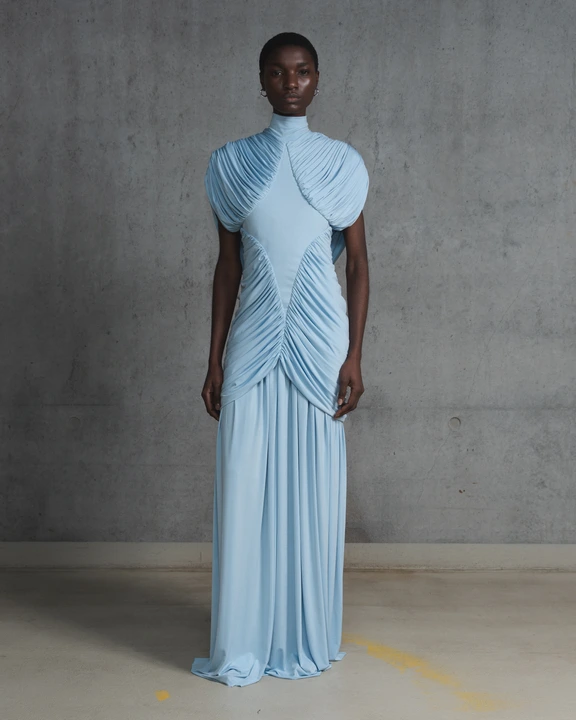Forza Collective editorial photograph — model wearing a light blue gown